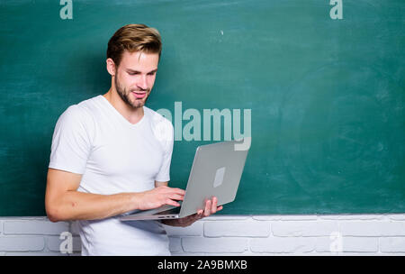 We Serve differently. back to school. business school. student man at e learning class. college teacher use computer technology. modern education online. man use 4g internet to study. Stock Photo