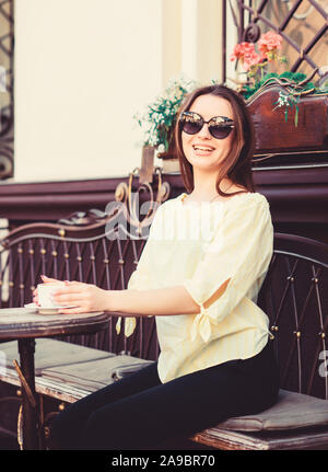 stylish woman in glasses drink coffee. girl relax in cafe. Business lunch. summer fashion beauty. Meeting in cafe. good morning. Breakfast time. morning coffee. Waiting for date. Morning coffee. Stock Photo