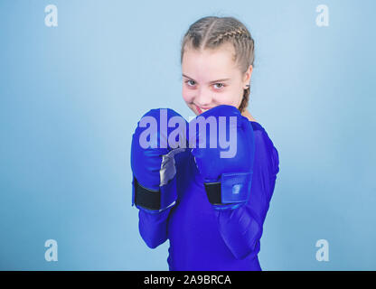 Girl cute boxer on blue background. With great power comes great