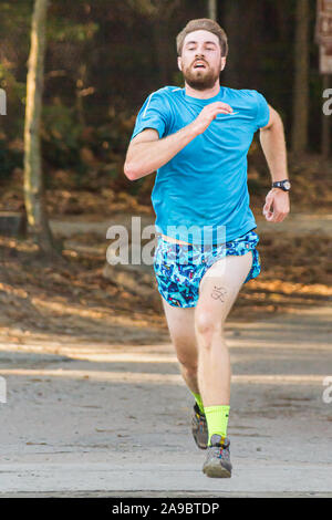 Runner competing in 'King of the James' triathlon. Stock Photo