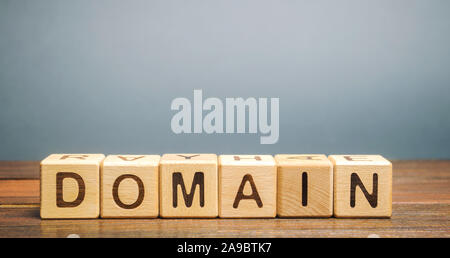 Wooden blocks with the word Domain. Internet address / name of the site, consisting of a set of characters and numbers Stock Photo