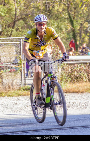 Cyclist competing in the 'King of the James' triathlon. Stock Photo