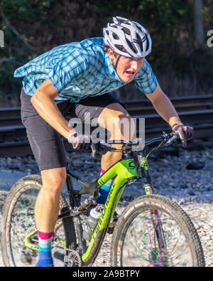 Cyclist competing in the 'King of the James' triathlon. Stock Photo