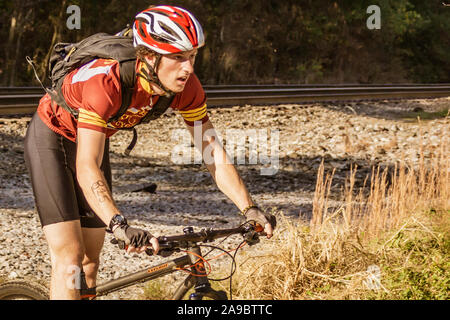 Cyclist competing in the 'King of the James' triathlon. Stock Photo