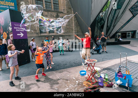 Making bubbles using detergent soap and rope on chopsticks. Stock Photo