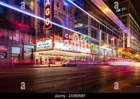The iconic Chicago Theatre on a cold winter night with a long exposure of vehicles passing by on State Street.