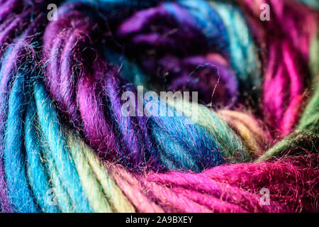 Closeup of deep rich jewel tone rainbow variegated skein of yarn Stock Photo