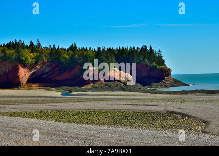 A landscape image of the beach and caves at Saint Martins on the Bay of Fundy in New Brunswick Canada. Stock Photo