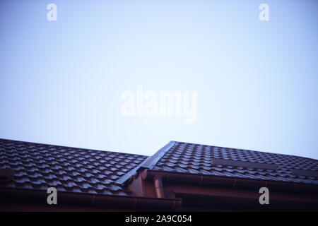 Unfocused brown metal roof under a blue sky Stock Photo