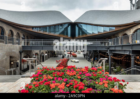 Coal Drops Yard, Kings Cross, a retail and lifestyle area made from converted Victorian industrial buildings in King’s Cross, London, UK Stock Photo