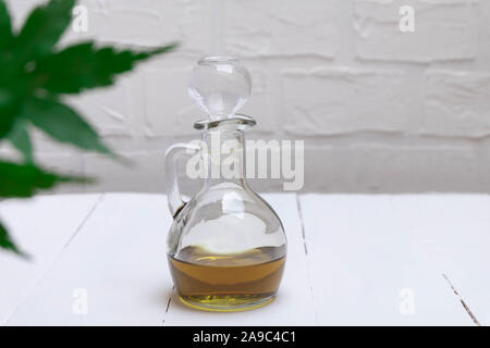 CBD cannabis oil in a jar on white table Stock Photo