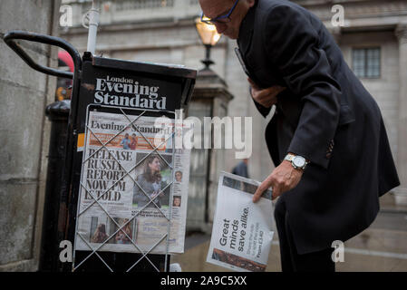 Copies of the London Evening Standard newspaper lead with a headline about government ministers' controversial decision to hold back until after the current general election, the release of a report about possible Russian interference in the 2016 EU Referendum, on 12th November 2019, in the City of London, England. Stock Photo