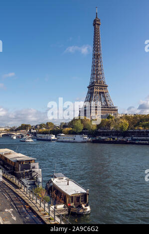 Eiffel tower across Seine River, in foreground are parked boats Stock Photo