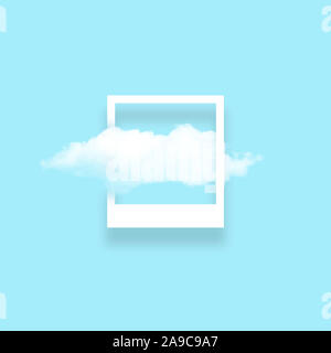 White cloud in snapshot frame illustration. Rectangular border with cotton candy isolated on baby blue color background. Creative artistic composition Stock Photo