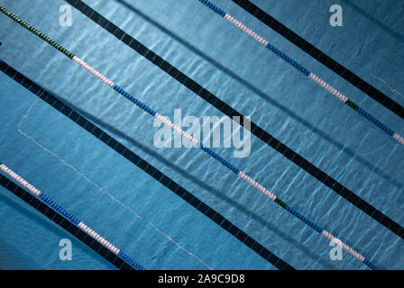 Olympic swimming pool. Water ripples on blue tiled olympic swimming pool background. View from above Stock Photo