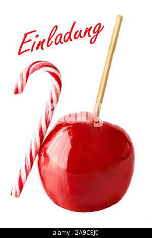 German: Invitation and candied apple on white background Stock Photo