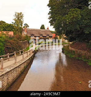 Thatched Cottage by the Beck in Thornton-le-Dale North Yorkshire Stock Photo