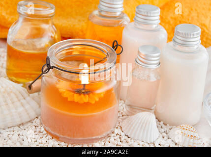 Summertime Beauty Care Cosmetics and Candle Stock Photo