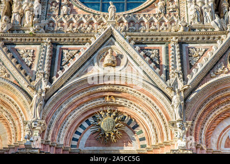 Siena Cathedral is a Italian romanesque-gothic cathedral with a striking facade is crowded with sculptures and architectural details,Tuscany, Italy Stock Photo