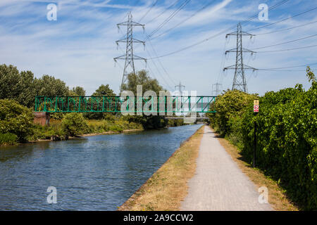 Walking along the River Lee Navigation towpath between Chingford and Enfield. Stock Photo