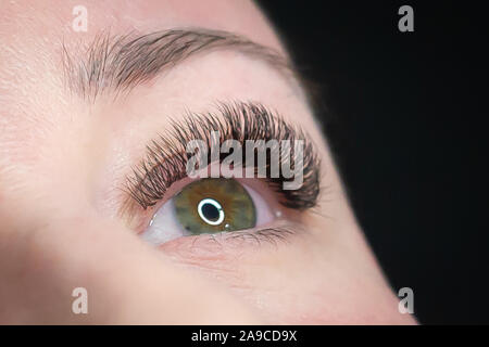 Woman getting a beautiful eyelashes extensions Stock Photo