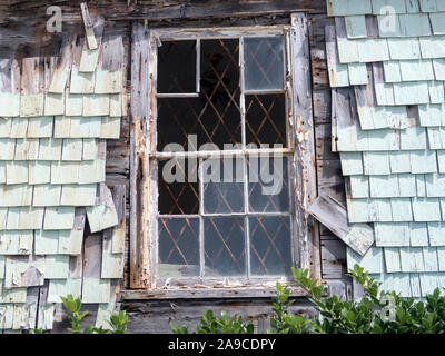 Dilapidated house with broken tiles in Hastings Rock on the Caribbean island of Barbados Stock Photo