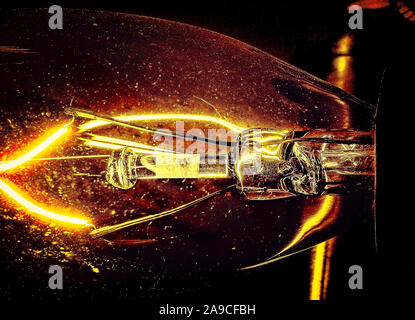 The inner filament of a candelabra light bulb is pictured lit, Jan. 20, 2016, in Coden, Alabama. Stock Photo