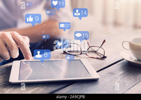 Social media network interactions concept with icons of comments, friend contact requests and messages showing engagement from users and digital marke Stock Photo