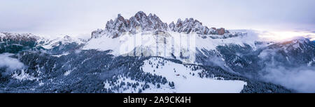 Scenic winter mountain landscape in Alps with aerial panoramic view of Geisler Peaks from Adolf Munkel trail in Zanser Alm, South Tyrol Dolomites with Stock Photo