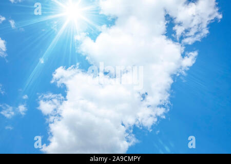 Bright blue sky with sun and white clouds Stock Photo - Alamy