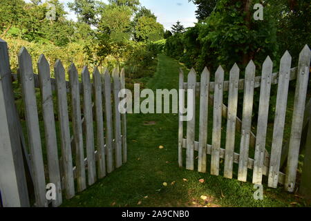 A White Picket Fence With An Open Garden Gate Stock Photo Alamy - white picket fence gate roblox