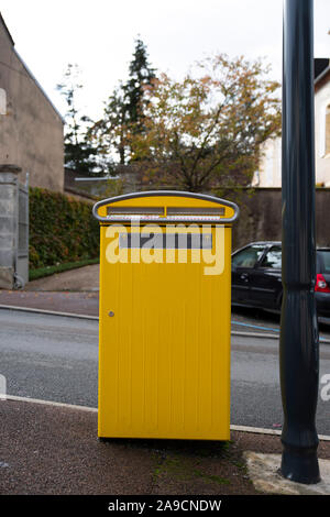 Yellow French letterboxes in a city center in village Stock Photo