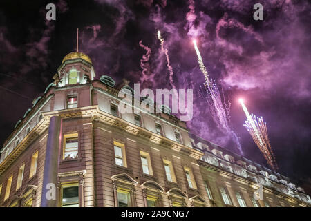 Regent Street, London, UK. 14th Nov, 2019. Fireworks accompany the switch on of the lights. The largest Christmas Light installation in London, Regent Street's 'The Spirit of Christmas', featuring illuminated angels spreading their wings, is switched on with a program of stage appearances, performers, festive activities, food and drink. Credit: Imageplotter/Alamy Live News Stock Photo