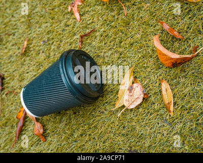 Discarded Hot Drinks Paper Cup with Plastic Lid Stock Photo