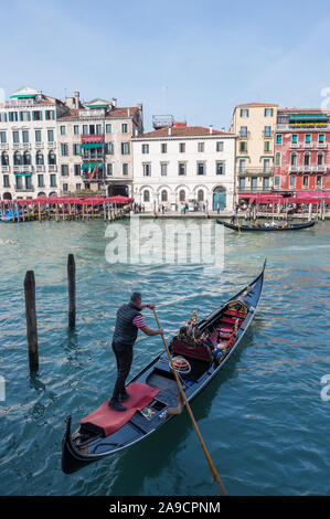 Gondola in Venice, Italy leaving the docks Stock Photo