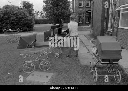Prison UK 1986. New mother whos baby has been born in the prison, she will push the pram around the grounds. HM Prison Styal Wilmslow Cheshire 1980s. England HOMER SYKES