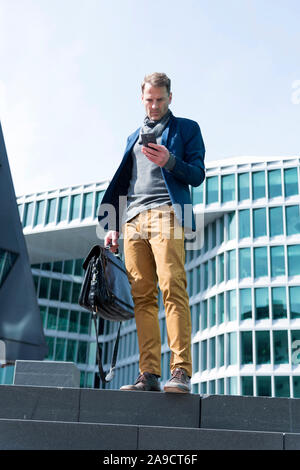 Business man, mobile phone, bag, outside, Stock Photo