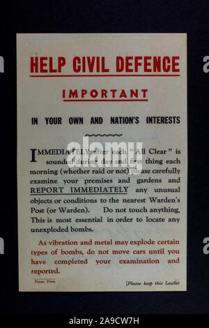 'Help Civil Defence' information poster advising homeowners to check their property, a piece of replica memorabilia from the Blitz era of the 1940s. Stock Photo