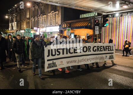 London, UK. 14 November, 2019. Members of the Grenfell community, joined by firefighters and wellwishers, take part in the 29th Grenfell Silent Walk around North Kensington on the monthly anniversary of the Grenfell Tower fire on 14th June 2017 during which 72 people died. It has been a difficult month for the Grenfell community following publication of the first phase of the Grenfell community and highly insensitive comments made by Leader of the House of Commons Jasob Rees-Mogg. Credit: Mark Kerrison/Alamy Live News