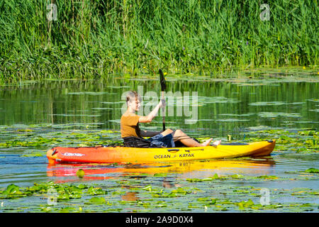 Recreational kayak and canoe boaters on the Au Sable River in the Pinery Provincial Park near Goderich Ontario Canada Stock Photo