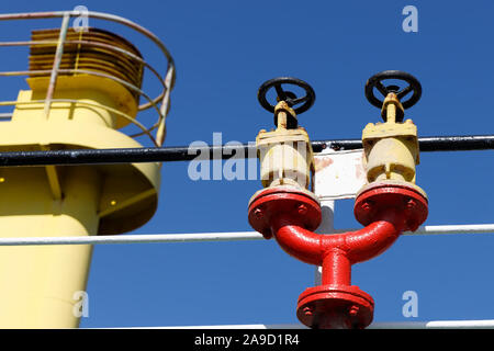 Double fire hydrant on the upper deck of a cargo ship. Stock Photo