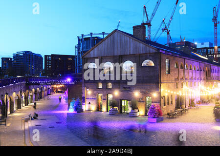 The amazing Christmas Northern Brights in the vibrant shopping and dining destination, Coal Drops Yard, at Kings Cross, north London, UK Stock Photo