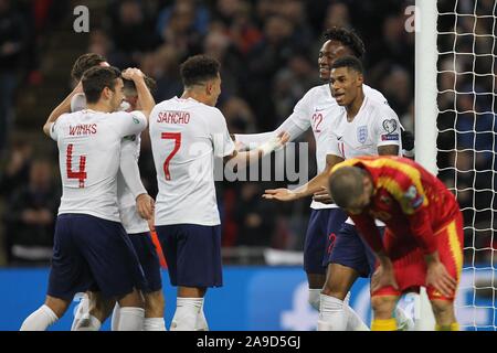 London, UK. 14th Nov, 2019. Tammy Abraham of England (2nd R) celebrates scoring to make it 6-0 during the UEFA Euro 2020 Qualifying Group A match between England and Montenegro at Wembley Stadium on November 14th 2019 in London, England. (Photo by Matt Bradshaw/) Credit: PHC Images/Alamy Live News Stock Photo