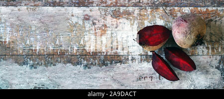 Beets on a wooden surface. Red beets whole and sliced. Selective focus. Macro. Copy space. Stock Photo
