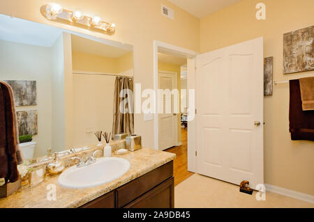 A guest bathroom is pictured at Cypress Cove Apartment Homes in Mobile, Alabama. The apartment complex is owned and operated by Sealy Management. Stock Photo