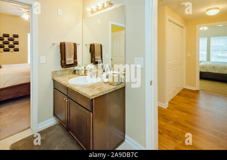 A bathroom sink is pictured at Cypress Cove Apartment Homes in Mobile, Alabama. The apartment complex is owned and operated by Sealy Management. Stock Photo