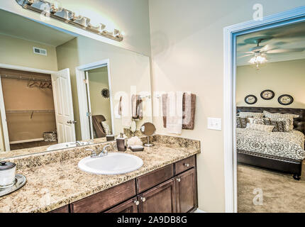 The master bathroom and master bedroom is pictured at Cypress Cove Apartment Homes in Mobile, Alabama. Stock Photo