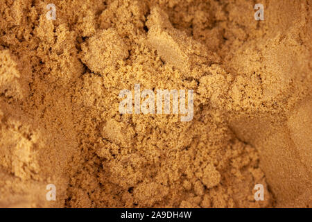 packed mounds of dark brown sugar granular Stock Photo