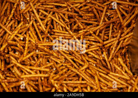 salt coated delicious looking snack sticks made of pretzels Stock Photo
