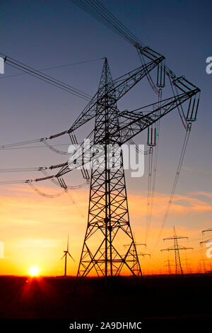 High voltage power lines in the morning light, Niederaussem, North Rhine-Westphalia, Germany Stock Photo